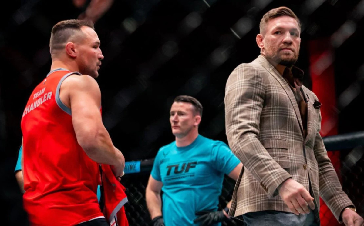 Michael Chandler and Conor McGregor inside the UFC Octagon on the set of "The Ultimate Fighter" (TUF 31).